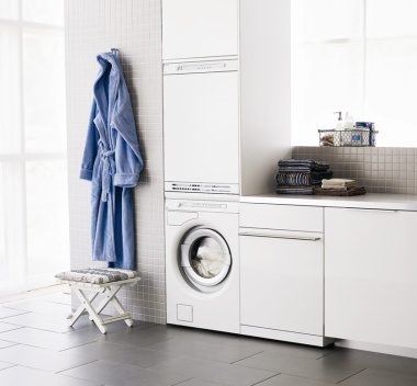 White laundry design with Asko appliances